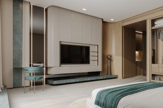 chambre élégante avec fauteuil bleu sarcelle et télévision murale