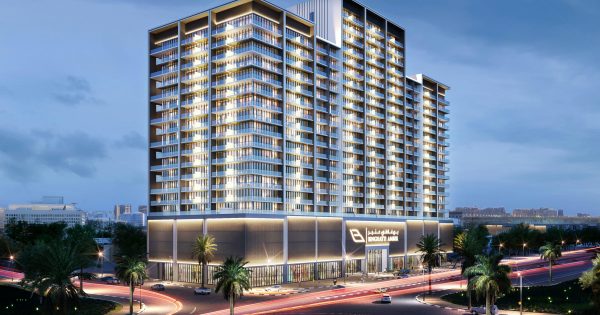 Bâtiment Binghatti Amber illuminé avec balcons entrelacés la nuit