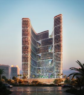 Tour résidentielle moderne avec balcons incurvés et végétation