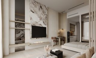Espace de vie d'un studio moderne avec canapé, télévision et coin repas