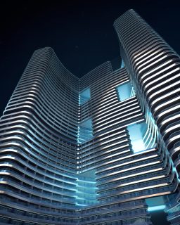 Vue nocturne du bâtiment moderne incurvé de Binghatti Hills