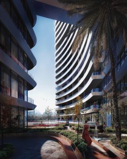 Bâtiment moderne avec balcons incurvés et jardins paysagers