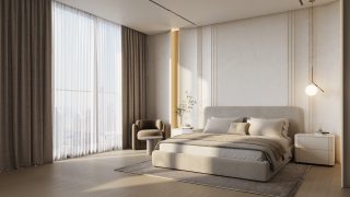 Chambre lumineuse avec grandes fenêtres et décor neutre