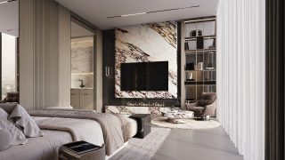 Espace de vie de studio avec mur d'accent en marbre et vue sur le balcon