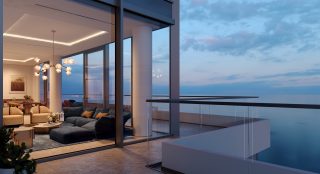 Balcon de penthouse luxueux surplombant une mer calme au coucher du soleil