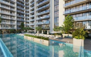 outdoor swimming pool with lounge chairs and greenery
