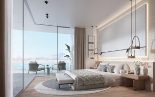 Chambre luxueuse avec mur vitré donnant sur l'océan