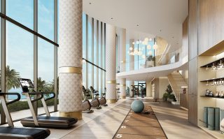 Salle de sport luxueuse avec vues sur l'océan et les palmiers
