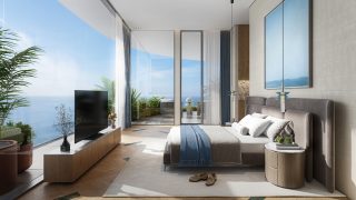 Chambre de penthouse luxueuse surplombant l'océan et la baie