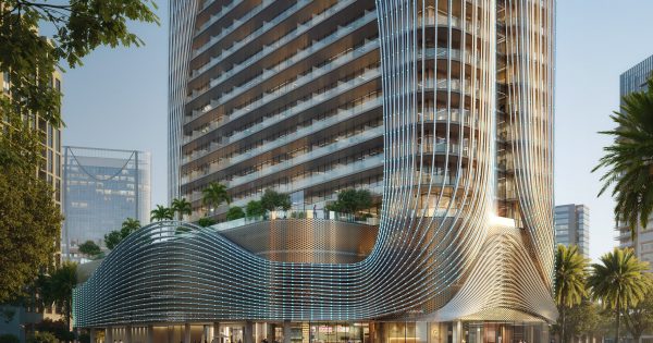 Édifice moderne en verre avec vue sur la ligne d'horizon de Dubaï