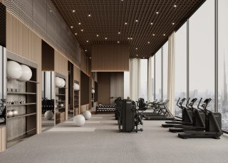 Salle de sport moderne avec appareils cardio et ligne d'horizon urbaine