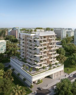 Bâtiment moderne avec balcons arrondis et verdure