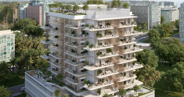 Bâtiment moderne avec balcons arrondis et verdure